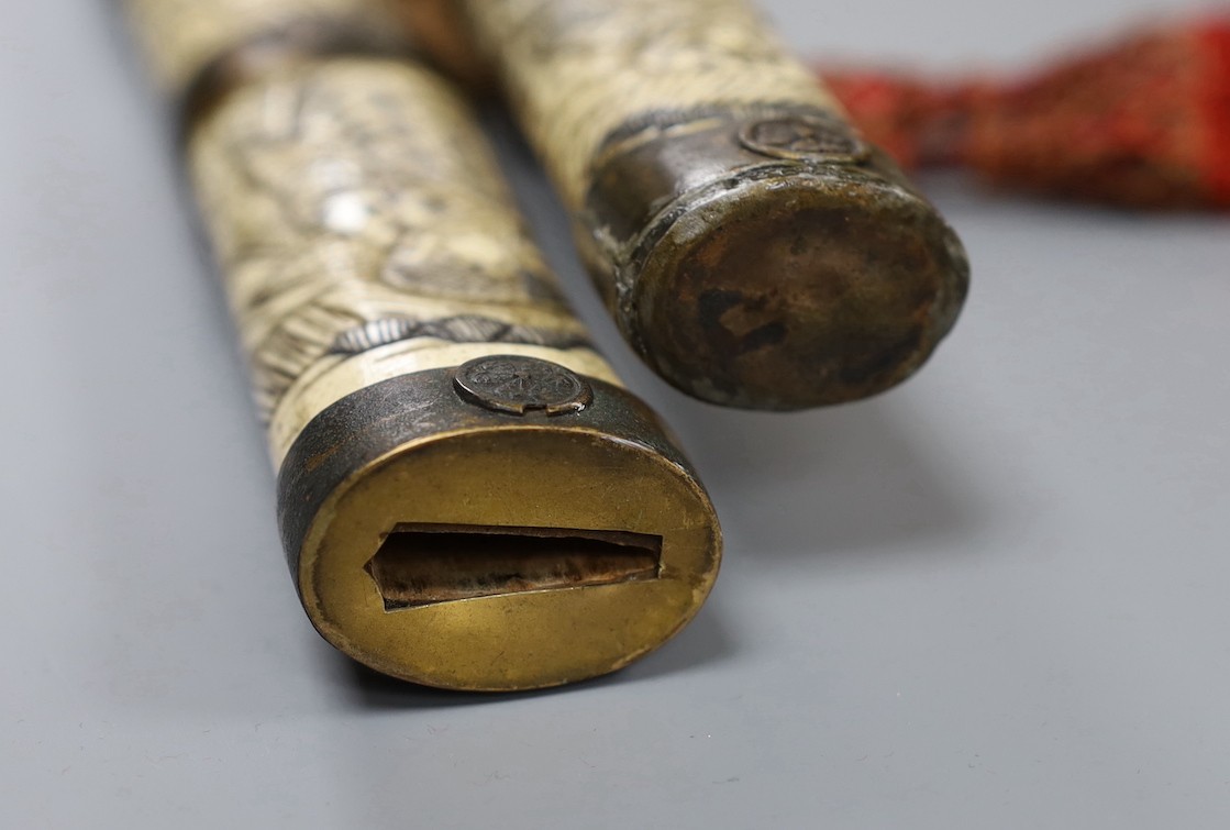 A late 19th century Japanese wakizashi sword, the blade 47.5cm, with sectional stag's horn scabbard and hilt carved with warriors and other figures, gilt metal mounted